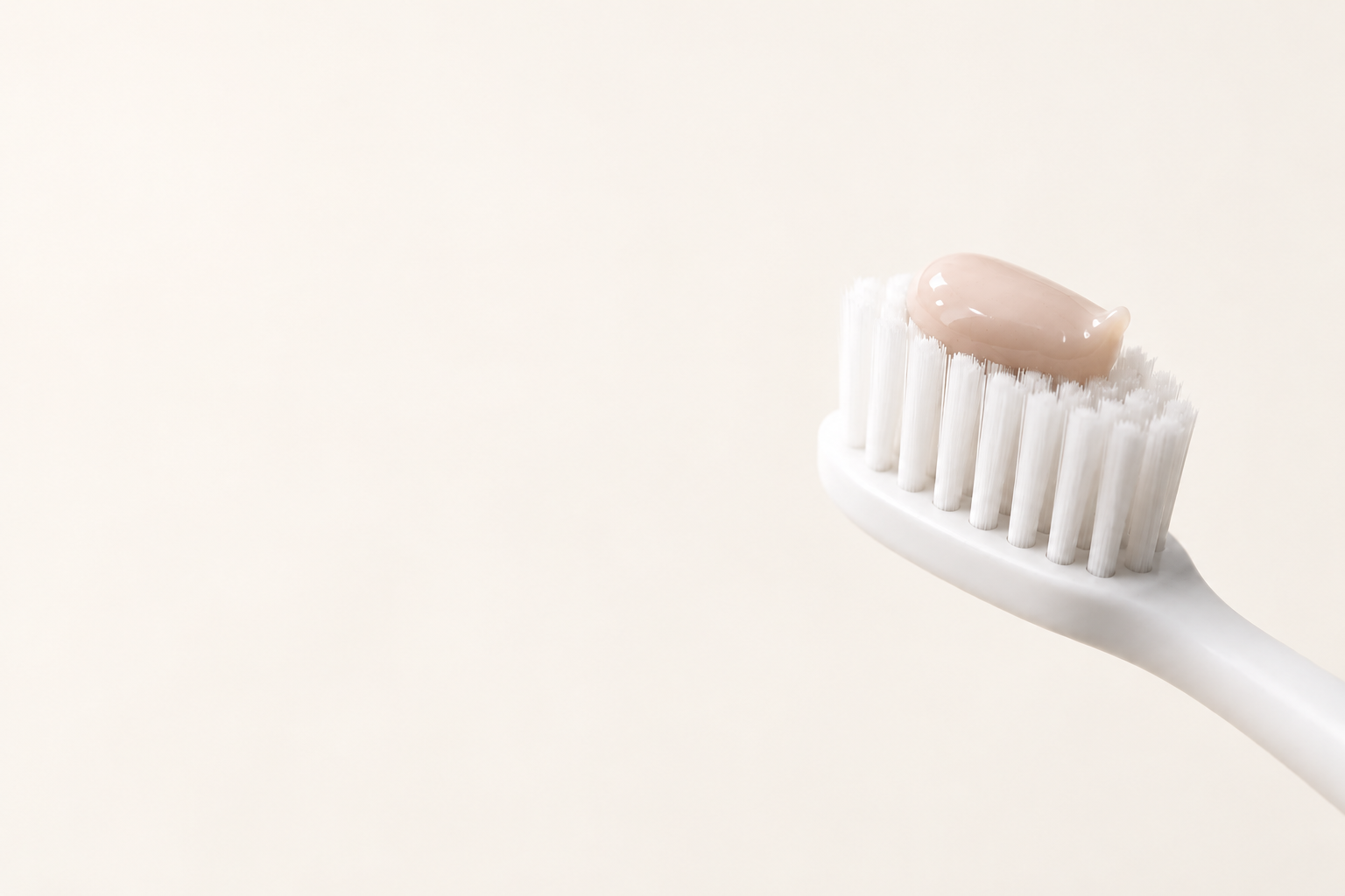 Strawberry paste on a white toothbrush